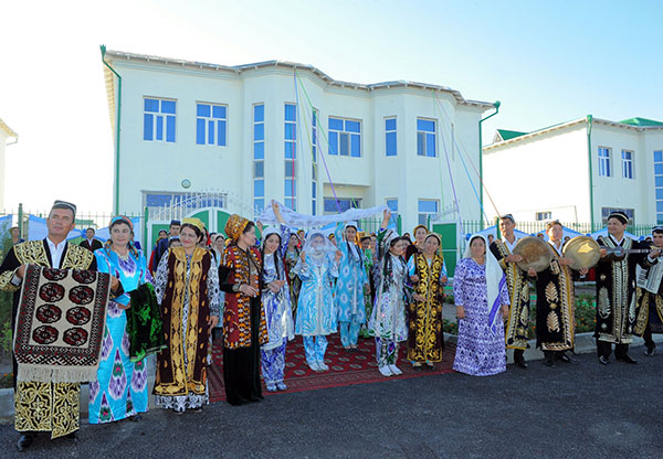 Citizens of Turkmenistan in their ethnic Turkmen and Uzbek dresses - 17 June 2016 - Dashoguz